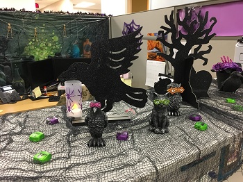 Photo of halloween decorations on a desk - cat, pumpkin