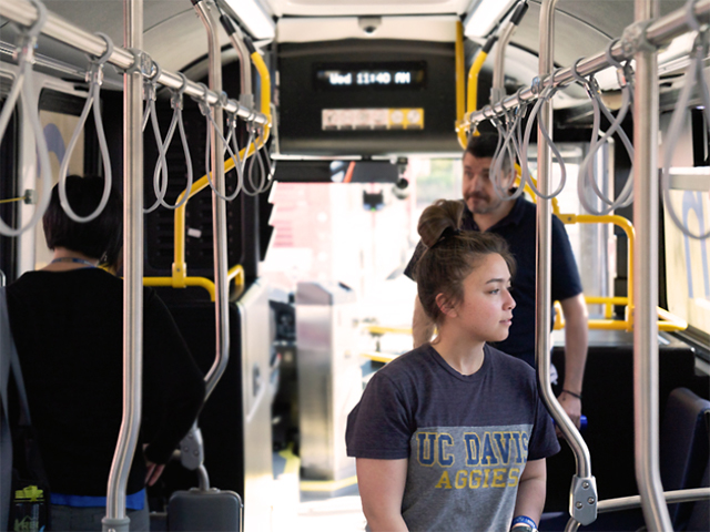 Riders aboard a bus.