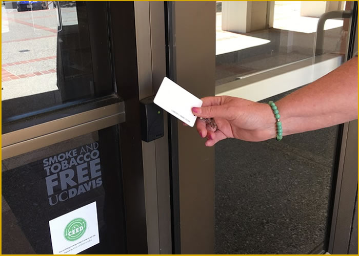 Photo of person holding a card-key.