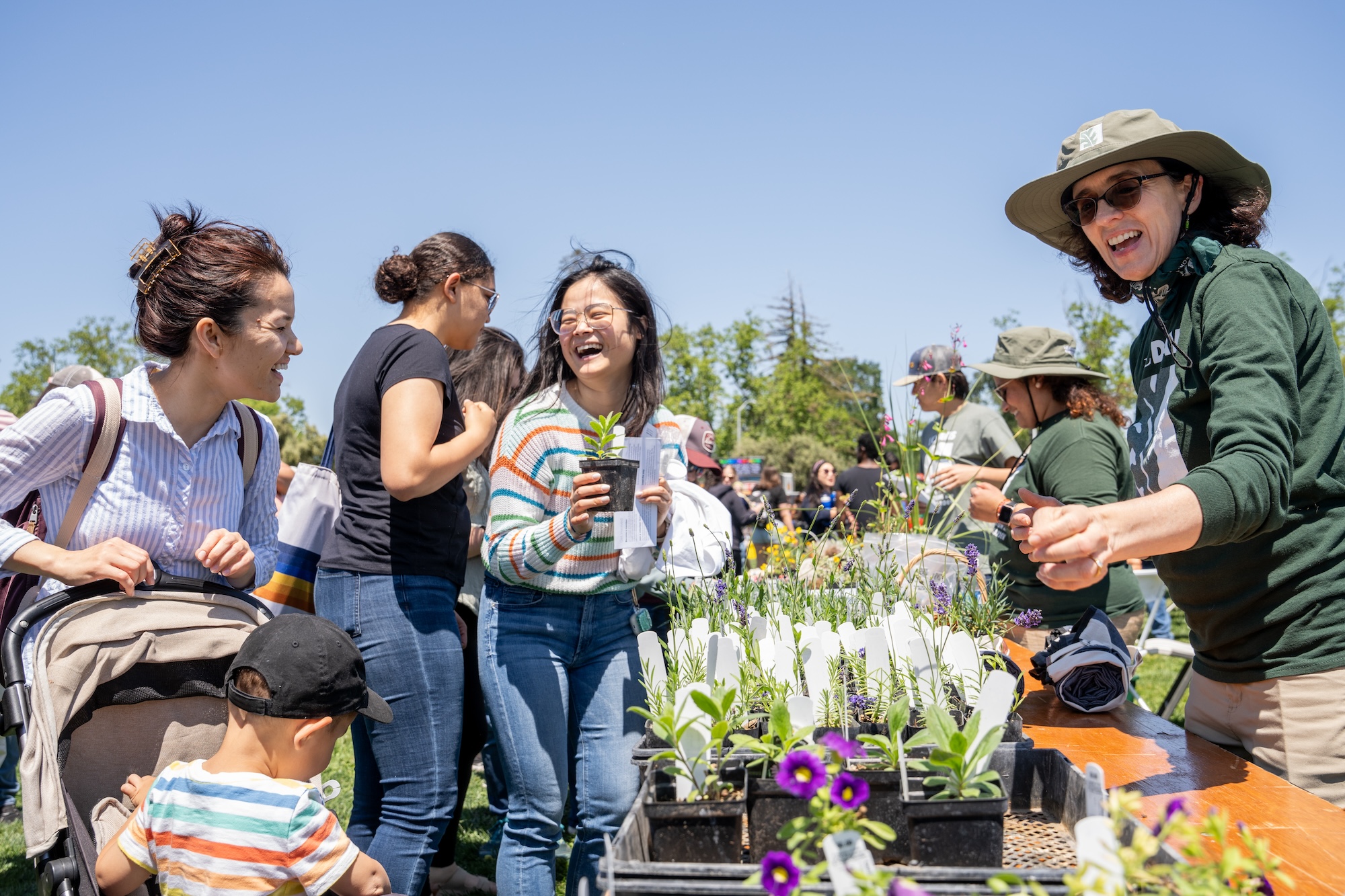 Arboretum and Public Garden staff members hand out plants at TGFS