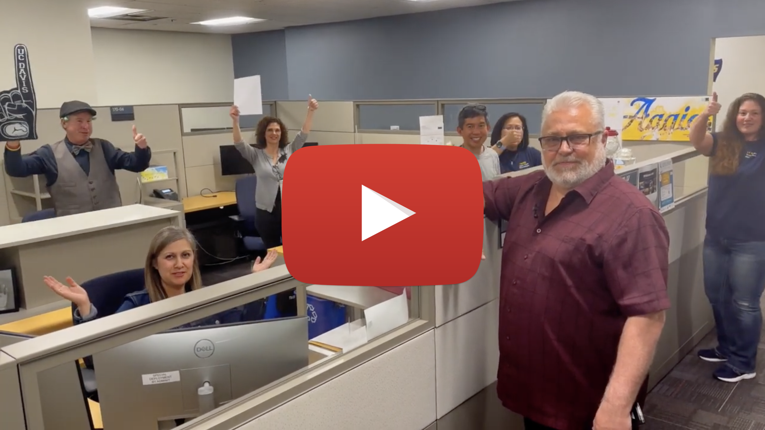 Several FOA employees pose and give thumbs up