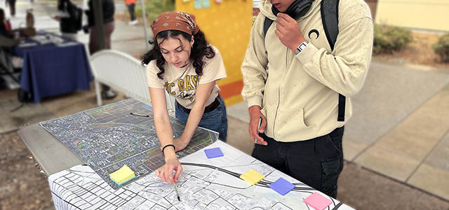 Design and Construction interns reviewing map.
