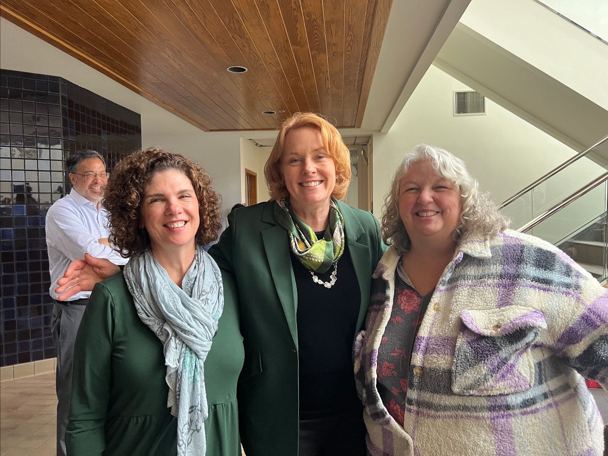 Vice Chancellor Clare Shinnerl poses with two other FOA employees