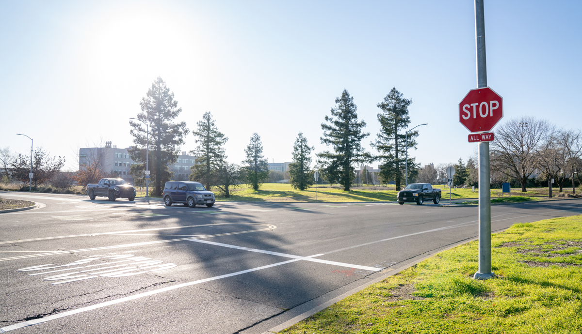 cars at the intersection of La Rue and Garrod, with new stop sign