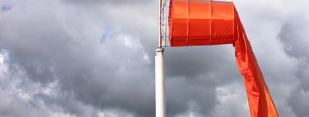 Orange windsock without wind