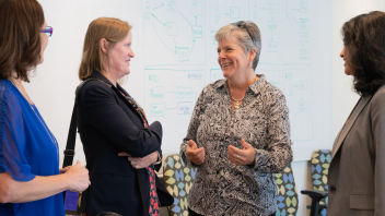 Kelly Ratliff with colleagues inside Mrak Hall