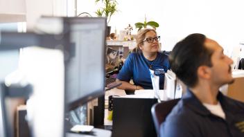 UC Davis employees look up from their desks.