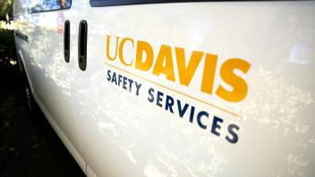 UC Davis Safety Services mark on the side of a van