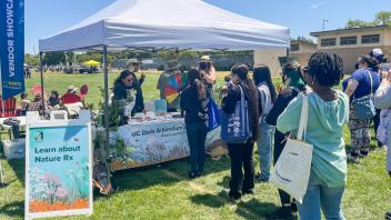 Staff members line up at the Arboretum and Public Garden table
