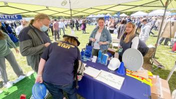 Staff members at the Design and Construction Management table