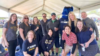 Staff members pose with Gunrock