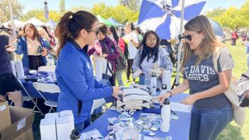 Staff Member picks out swag at the Safety Services table