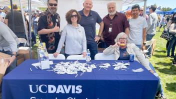 Supply Chain Management staff members pose at their table