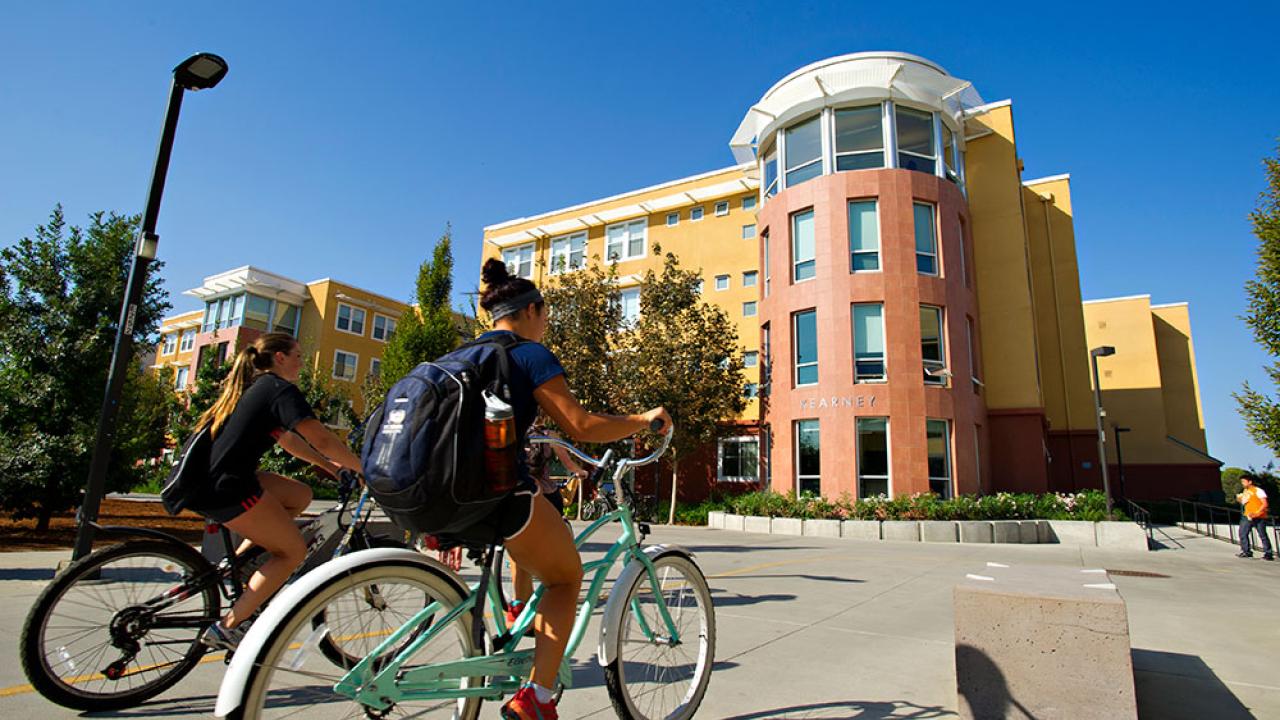 Photo of students riding bikes.