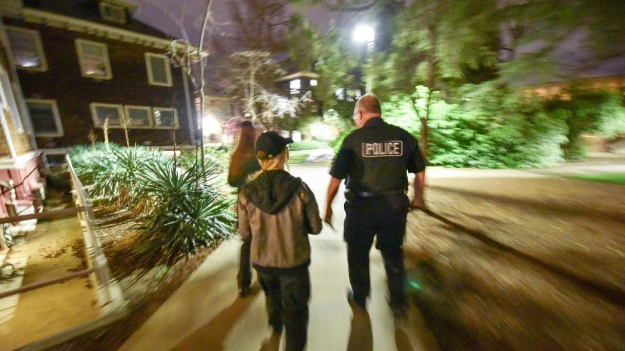 Photo of volunteers and police on lighting walk.