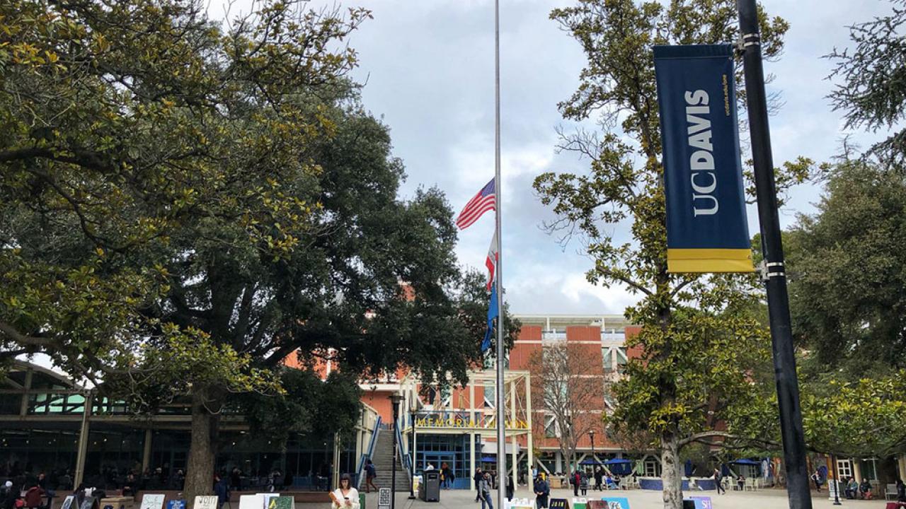 (Photo: UC Davis) Photo of flag at half-mast outside Memorial Union.