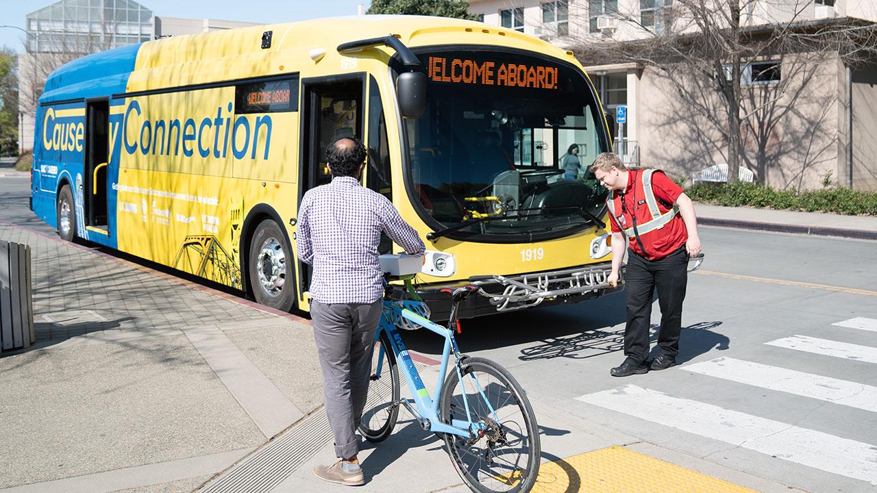 (Photo: Henri Teixeira/UC Davis) Loading bicycle onto bus.
