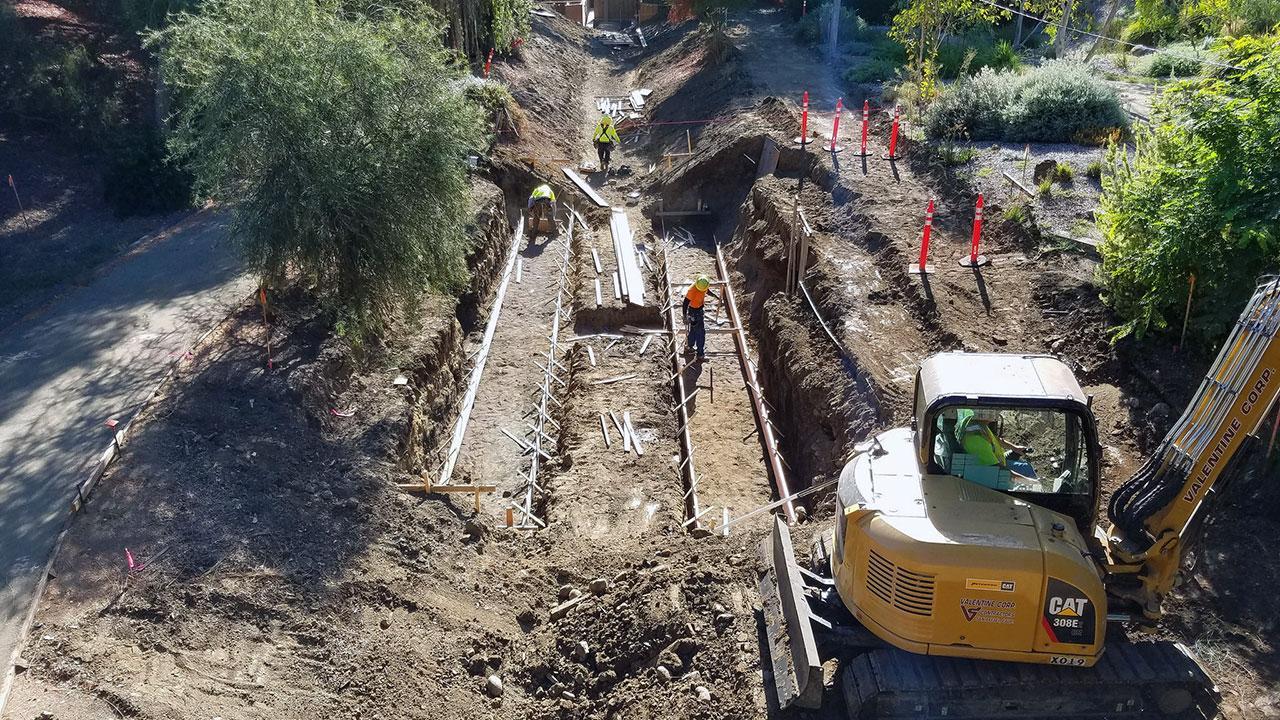 Photo of crew performing maintenance tasks in the arboretum waterway.