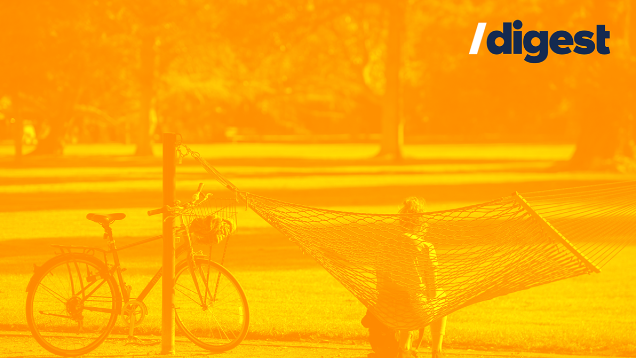 Someone sitting in a hammock on the quad. /digest