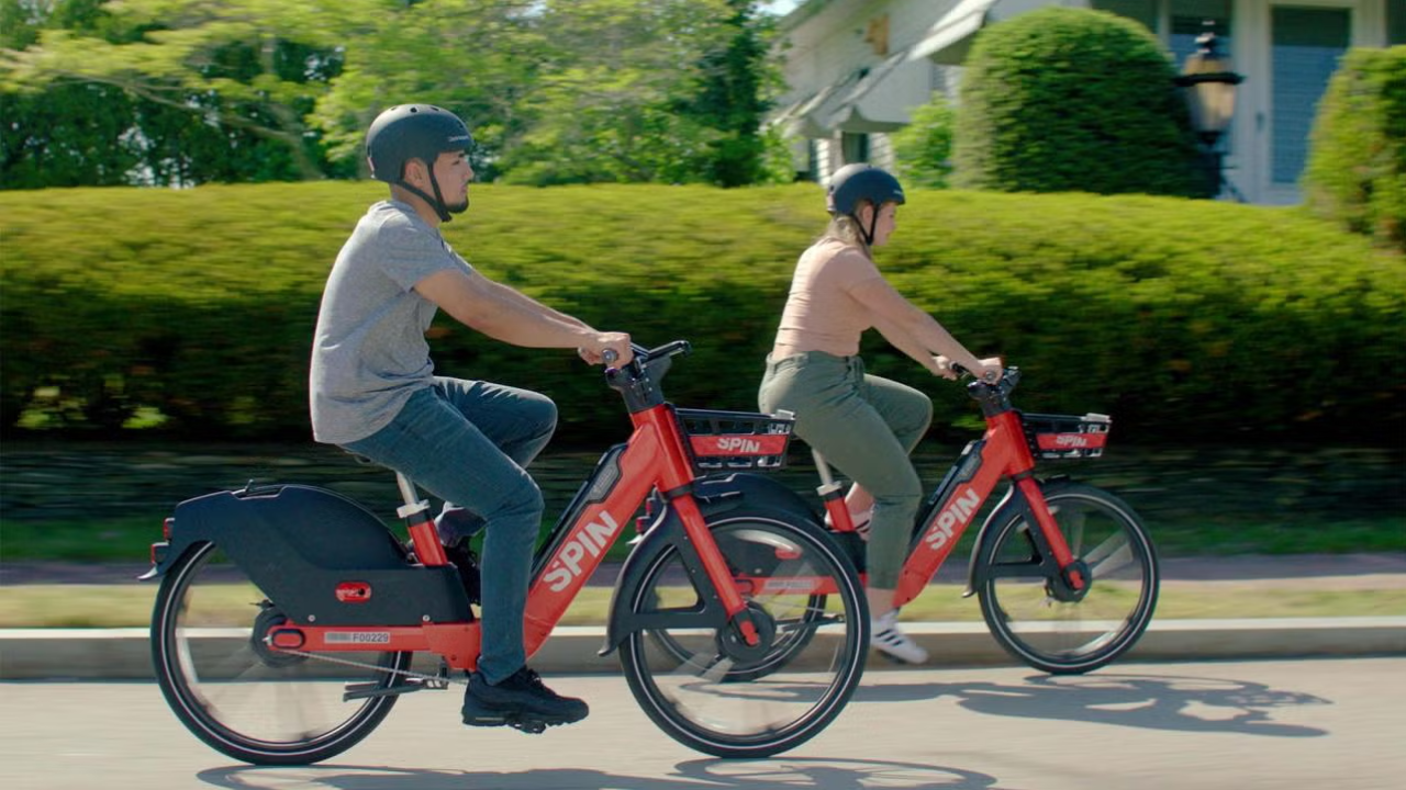 Two People Ride Spin e-bikes