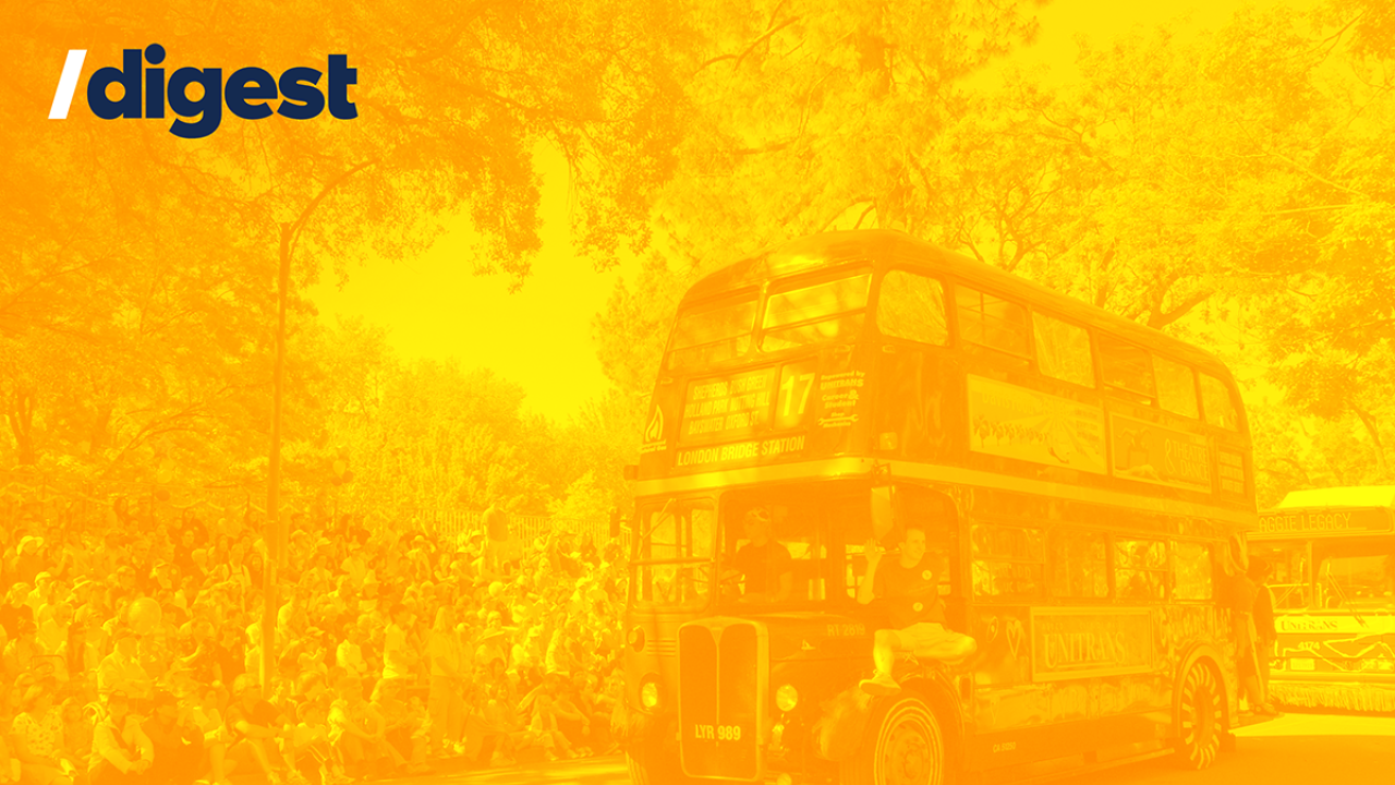 /digest vintage double-decker Unitrans bus in a Picnic Day parade