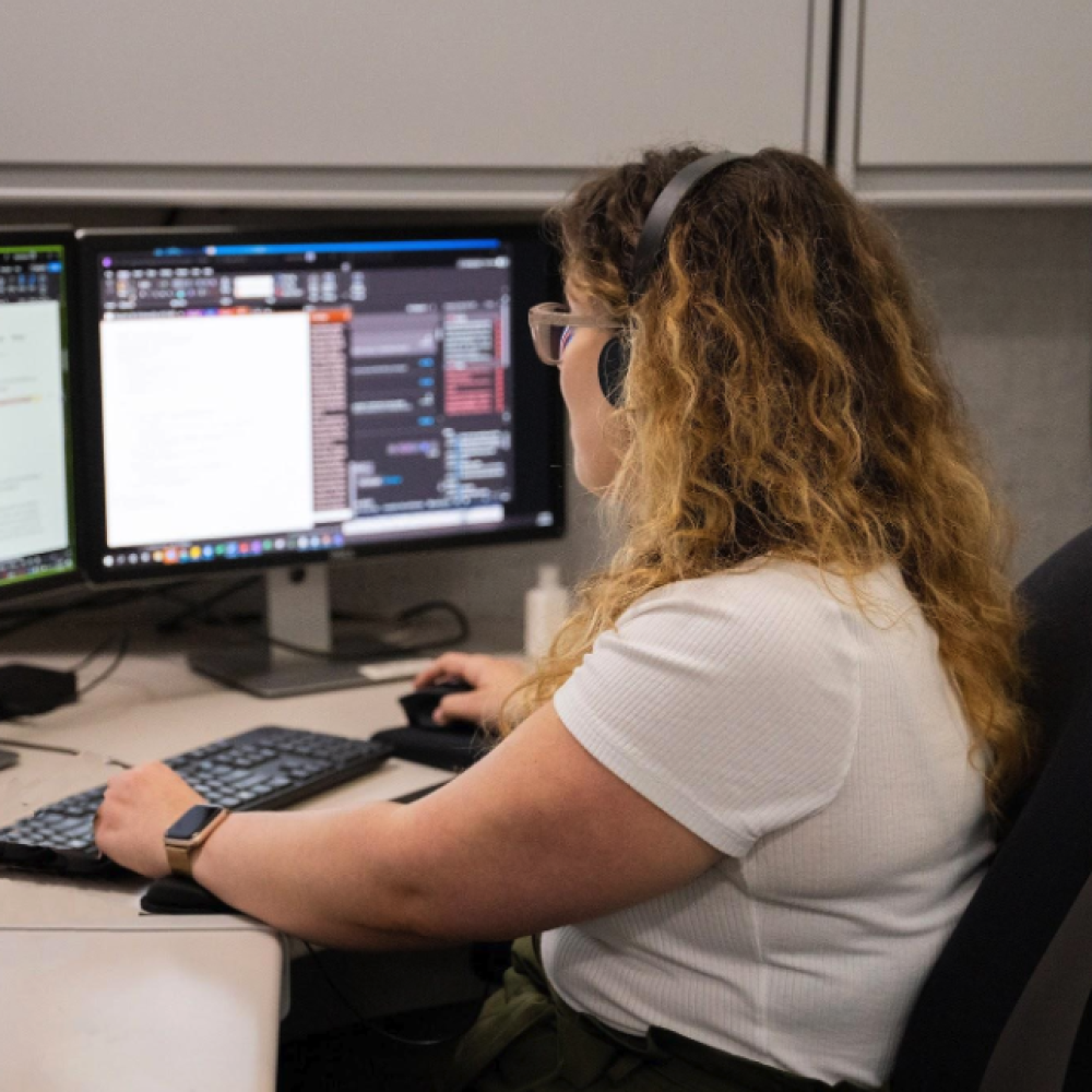 student working at computer screen