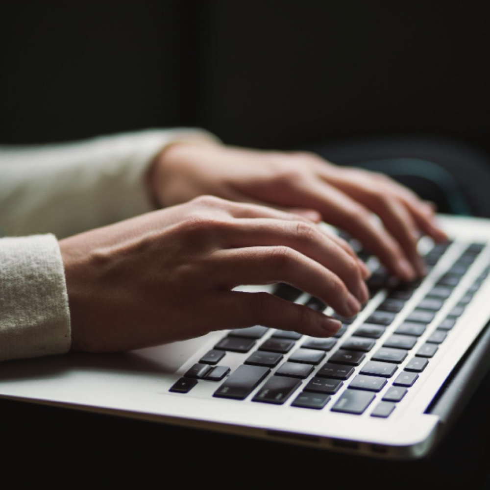 woman typing on keyboard