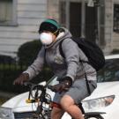 people wearing N-95 masks while riding bicycles in Davis Ca on a smoky day. 