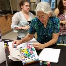 Photo of instructor and students in a lab.