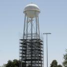 Scaffolding around the legs of a water tower on the UC Davis campus