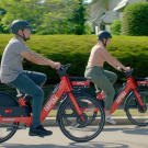 Two People Ride Spin e-bikes
