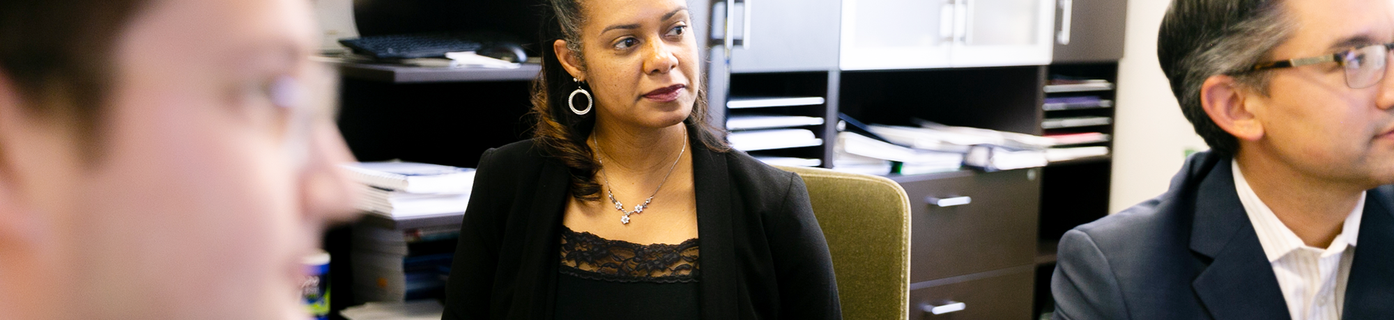 uc davis employees in a meeting with one another