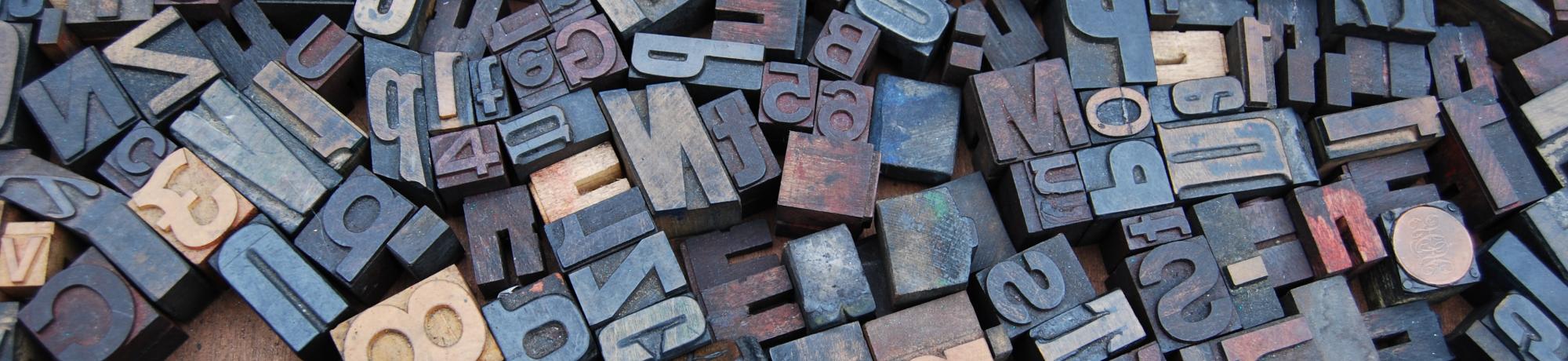 typography - pile of metal type from letterpress